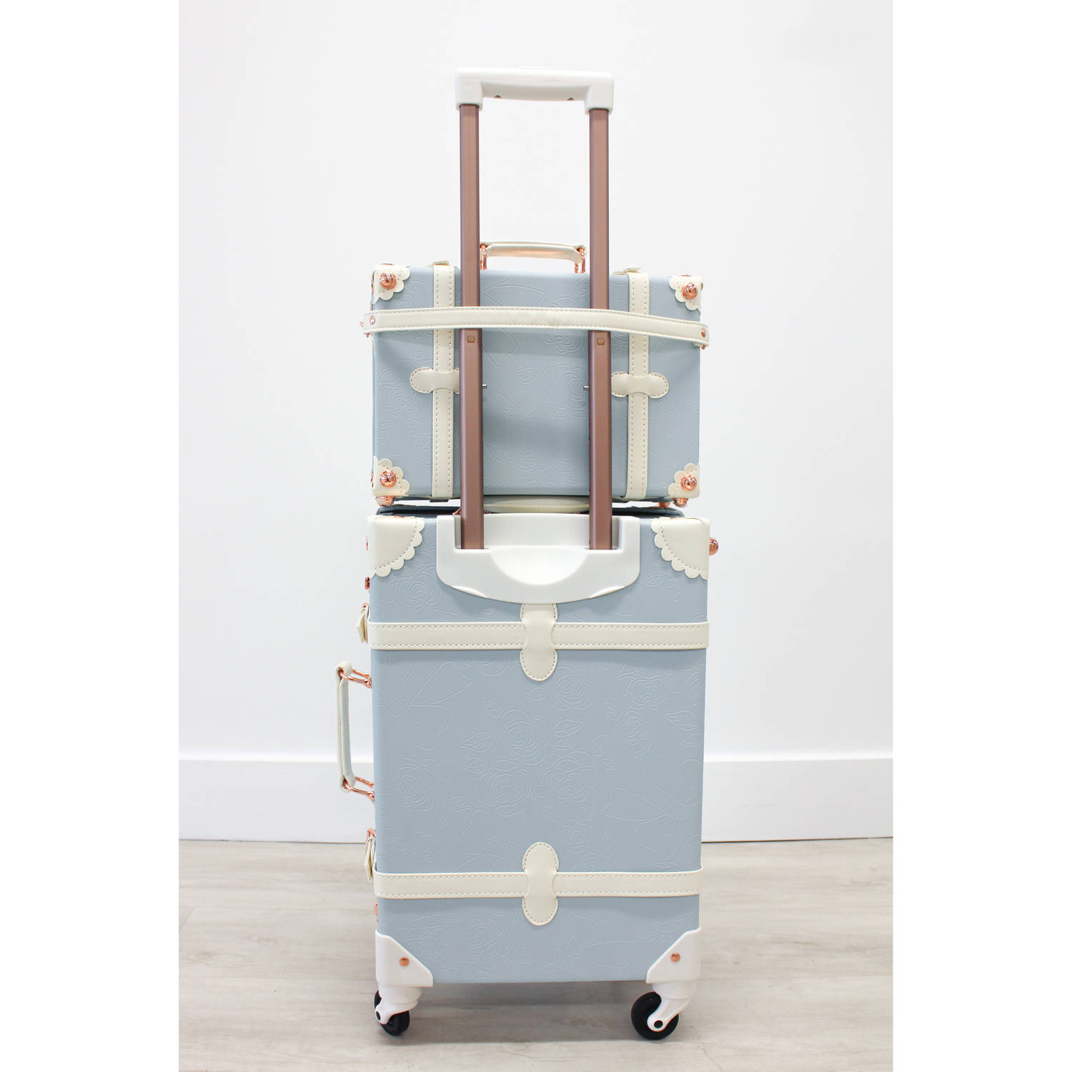 The Audrey Collection vintage suitcase - back view showing ergonomic handles, telescopic handle strap for train case, and 360° spinner wheels