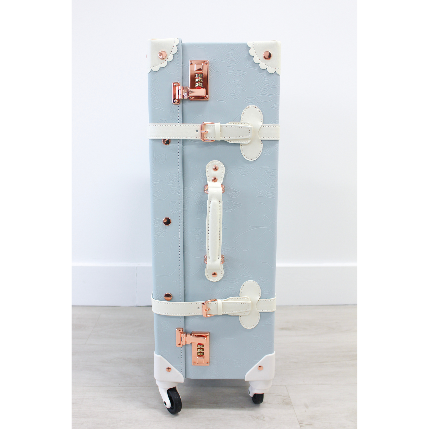 The Audrey Collection vintage suitcase - side view showing ergonomic handles and 360° spinner wheels