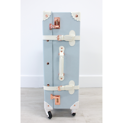 The Audrey Collection vintage suitcase - side view showing ergonomic handles and 360° spinner wheels